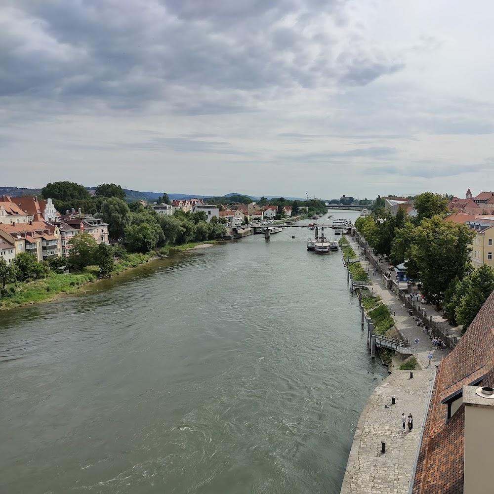River, cityscape, and a stone path.